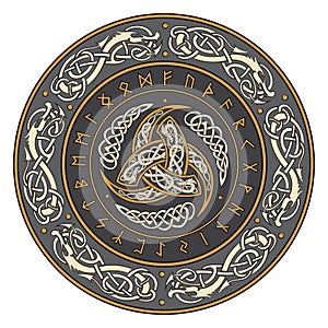 Triple Horn of Odin decorated with Scandinavian ornaments and runes photo