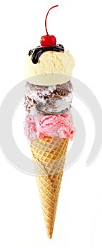 Triple scoop ice cream cone with cherry on top isolated on a white background