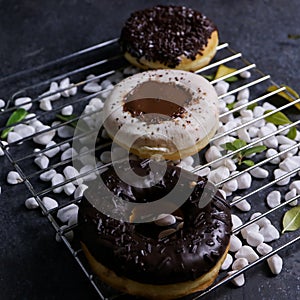 Triple sweet Chocolate Donuts on tray