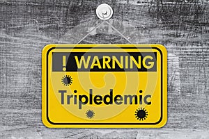 Tripledemic message for RSV, covid-19 and flu yellow warning sign photo