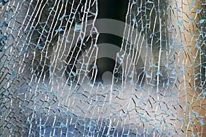 Triplex glass broken into small pieces close up