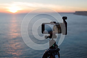 Tripod-mounted camera and ocean