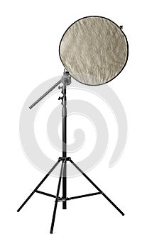 Tripod with studio reflector isolated on white. Professional photographer`s equipment