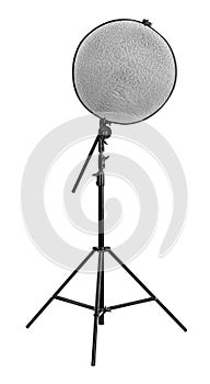Tripod with studio reflector isolated on white. Professional photographer`s equipment
