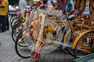 Trishaw decorated with colorful flowers photo