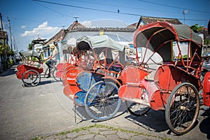 Trishaws in the street of Surakarta, Indonesia photo