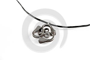 Triskel silver pendant necklace on white background