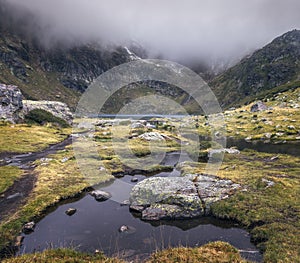 Tristaina Lakes Embraced by Mist in Andorra