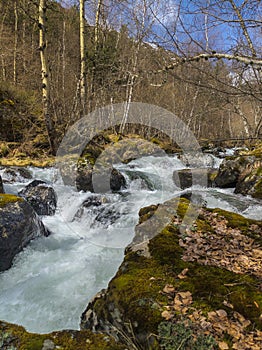 The Tristaina river splashing over huge boulders