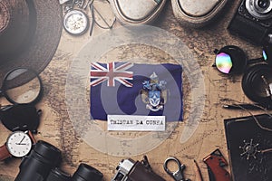 Tristan da Cunha Flag Between Traveler`s Accessories on Old Vintage Map. Overhead Shot