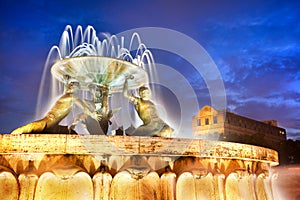 The Triton Fountain at the entrance of Valletta, Malta photo