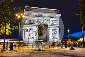 Triumphal arch Arc de Triomphe at night, Paris, France
