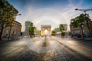 Triumphal Arch at the end of Champs-Elysees street before sunset