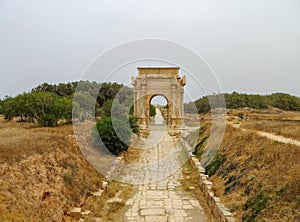 Ancient Roman Arch of Septimius Severus at Leptis Magna on the Mediterranean coast of Libya in North Africa photo