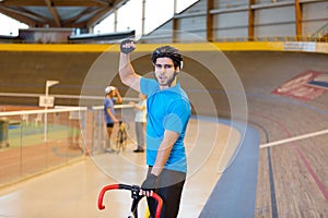 triumphant cyclist in velodrome photo