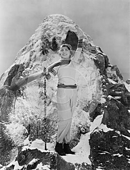 Triumphant woman at mountain summit photo