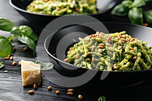 Trofie pasta with creamy spinach sauce and toasted pine nuts