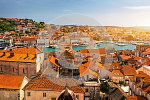 Trogir in Croatia, town panoramic view with red roof tiles, Croatian tourist destination. Trogir town sea front view, Croatia. photo