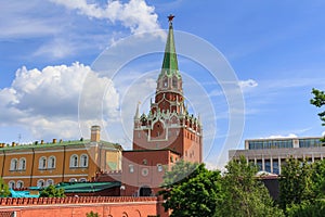 Troitskaya tower of Moscow Kremlin on a blue sky background in sunny summer day