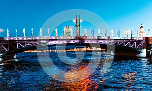 Troitskiy Trinity Bridge over the Neva River with night illumination. Saint-Petersburg. Russia