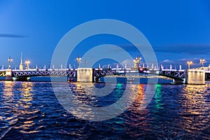 Troitskiy Trinity Bridge over the Neva River with night illumination. Saint-Petersburg. Russia