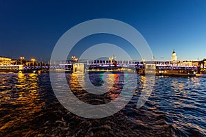 Troitskiy (Trinity) Bridge over Neva River with night illumination. Saint-Petersburg. Russia