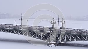 Troitsky bridge in the city center view of the frozen Neva river. Winter time