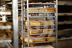 Trolley with baked bread in bakery