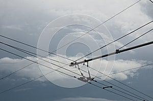 Trolley bus street wire line with clouds on background