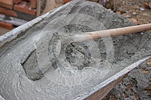 Trolley with Concrete and shovel, close up