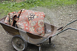 Trolley loaded with discarded carpet