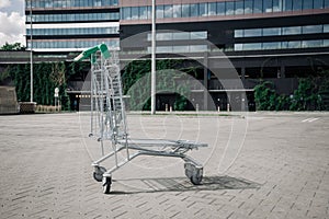 Trolley shopping. Empty shopping trolley cart at supermarket parking lot. Time for shopping household goods, snacks or
