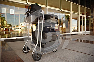 Trolley with suitcases at hotel