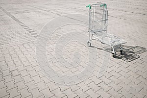 Trolley supermarket. Empty shopping trolley cart at supermarket parking lot. Sale buy mall market shop consumer concept.