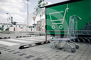 Trolley supermarket. Empty shopping trolley cart at supermarket parking lot. Sale buy mall market shop consumer concept.