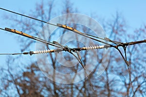 Trolleybus wires against the blue sky