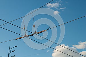 Trolleybus wires against the blue sky