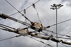 Trolleybus wires against the blue sky. close up.