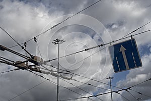 Trolleybus wires against the blue sky. close up.