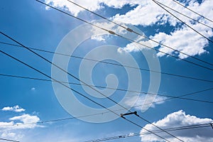 Trolleybus wires and sky with clouds