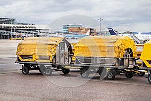 Trolleys loaded with luggage at an airport