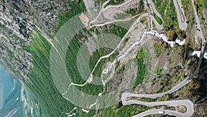 Trollstigen, Andalsnes, Norway. Cars Goes On Serpentine Mountain Road Trollstigen. Famous Norwegian Landmark And Popular