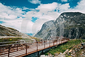 Trollstigen, Andalsnes, Norway. People Tourists Walking Visiting Viewing Platform Near Visitor Centre. Famous Norwegian