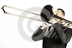 Trombone player. Trombonist playing jazz musician  on white