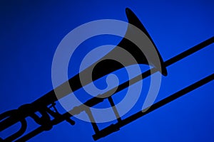 Trombone Silhouette Isolated on Blue