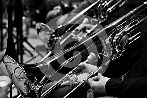 Trombones in the hands of the musicians
