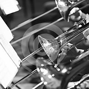 Trombones in the hands of the musicians