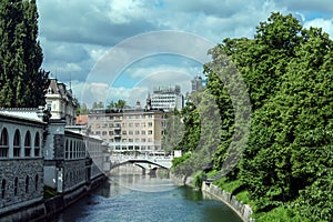 Tromostovje bridge Triple Bridge in Ljubljana Slovenia seen from apart. The bridge, over the Ljubljanica river.