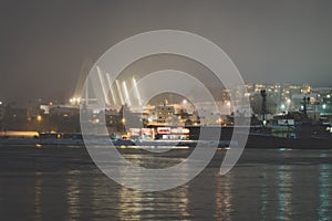 Tromso Bridge across Tromsoysundet strait at night