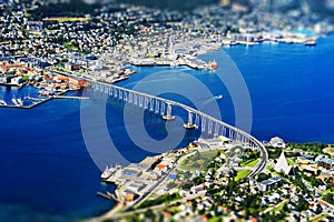 Tromso bridge from high altitude mountain bokeh background